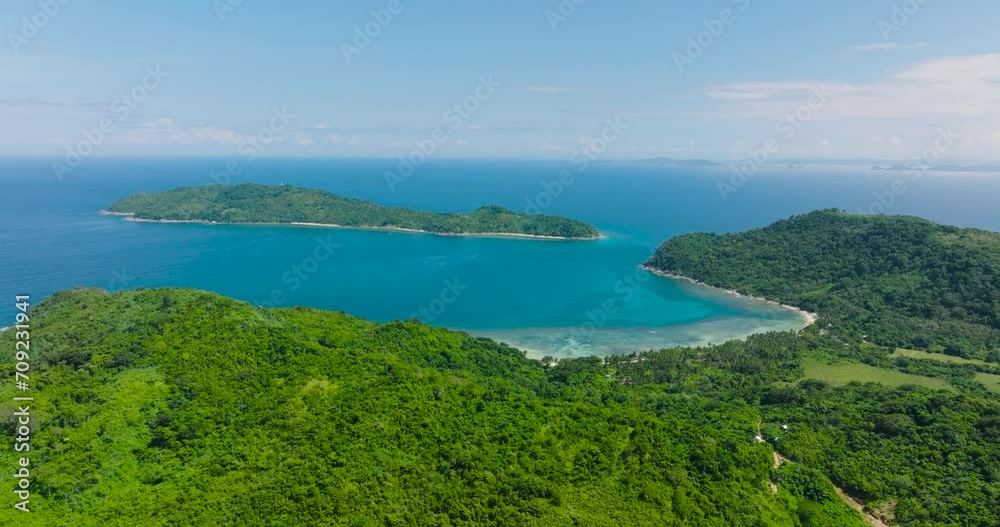 Aerial view of green plants in tropical island with beach in El Nido, Palawan. Philippines. Aerial view of green plants in tropical island with beach in El Nido, Palawan. Philippines.