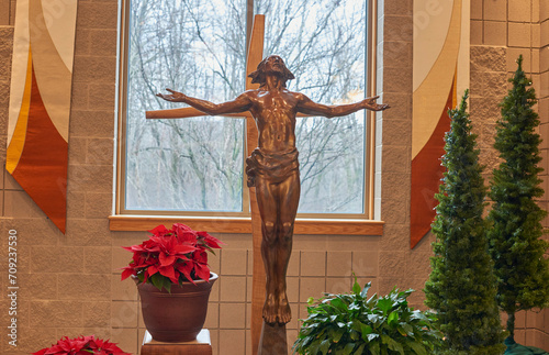 Catholic Church. Statue of Jesus Chris impaled on cross in sanctuary