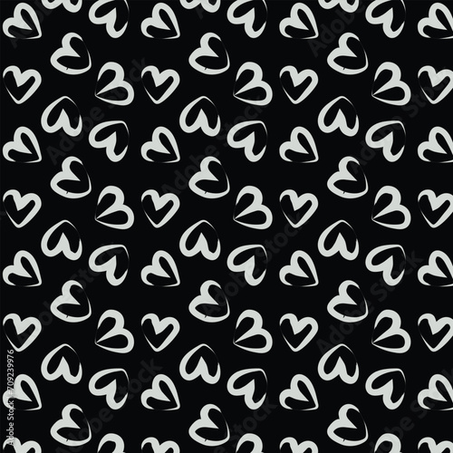 Seamless background pattern with hand drawn textured hearts. Black and white.