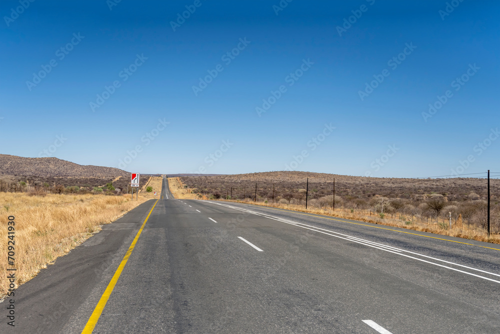 tar road in barren countryside, near Karibib,  Namibia