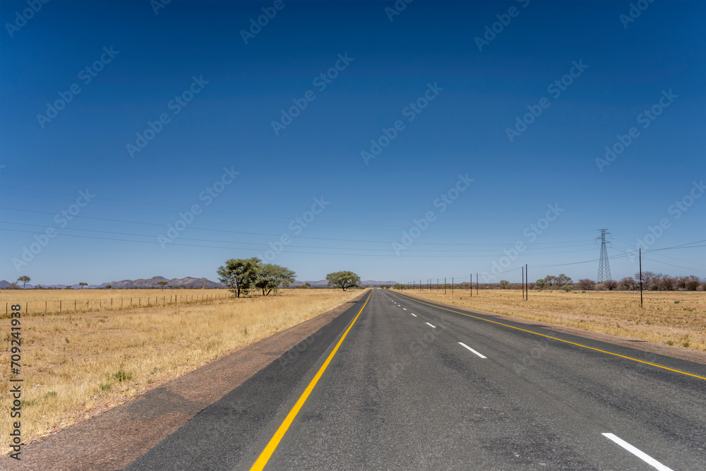 tar road in barren countryside, near Usakos,  Namibia