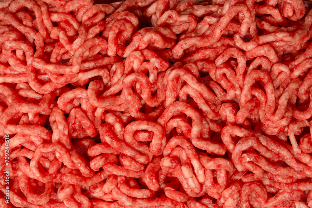 Raw minced beef close-up, top view. Raw minced beef close-up, top view.
