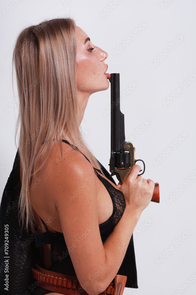 Beautiful woman in black lingerie holding big old revolver Beautiful woman in black lingerie holding big old revolver