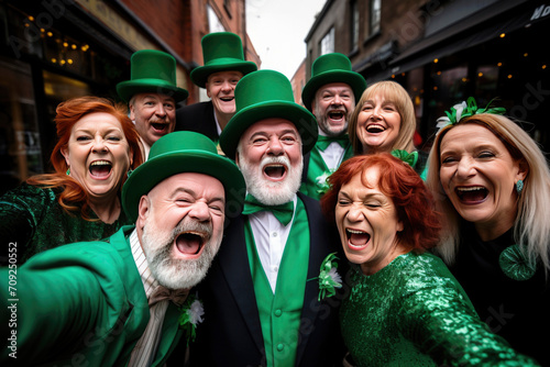 Group of people celebrating wearing green clothes and leprechaun hats