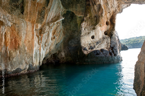 Large natural sea cave surfaced along the coast. Cilento area, Italy.