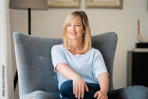 Portrait of blond haired woman relaxing at home