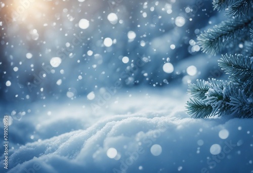 Christmas winter snow background with fir branches macro with soft focus and snowfall in blue tones