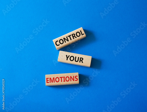Control Your Emotions symbol. Concept word Control Your Emotions on wooden blocks. Beautiful blue background. Psychology concept. Copy space