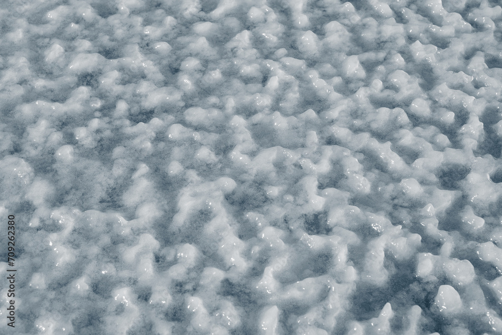 Frozen snow surface covered with a crust of ice. Frozen snow surface covered with a crust of ice.
