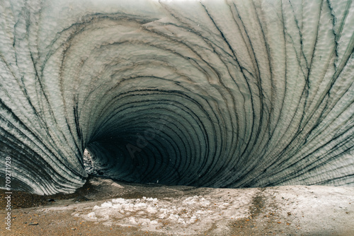 Rounded tunnel ice cave view from the inside. Cueva de Jimbo, Ushuaia, Tierra del Fuego photo