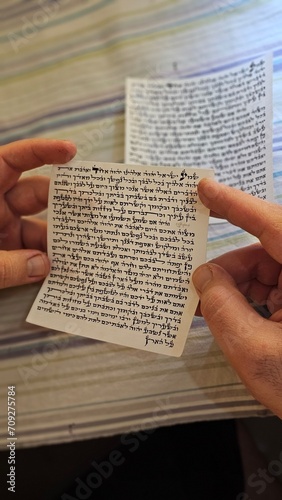 inside Mezuzah jewish Papyrus scroll Klaf inscribed with Hebrew verses from the sefer Torah Jewish mitzvah prayer Shema Yisrael
