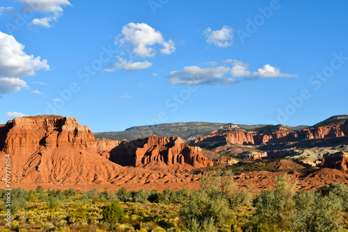 Green field and red rocks at Capitol Reef National Park.