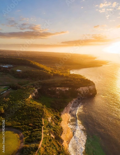 sunset over the sea with cliff beach and green nature
