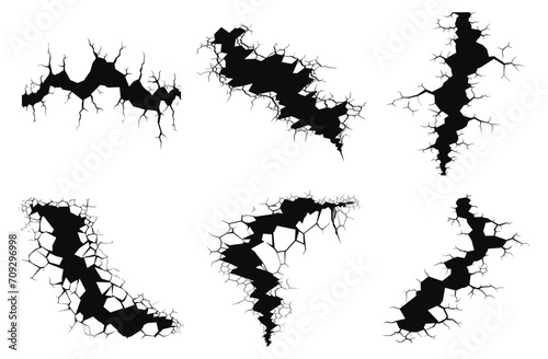Earth clefts. Rock cracking black icons on white, ground surface crash signs, crashing holes symbols, damaged wall vector lines