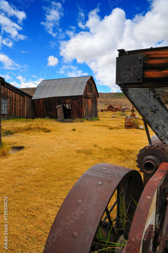 Adandoned buildings and vehicles at the Bodie State Historic Park, a gold rush ghost town east of the Sierra Nevada of California, western USA. photo