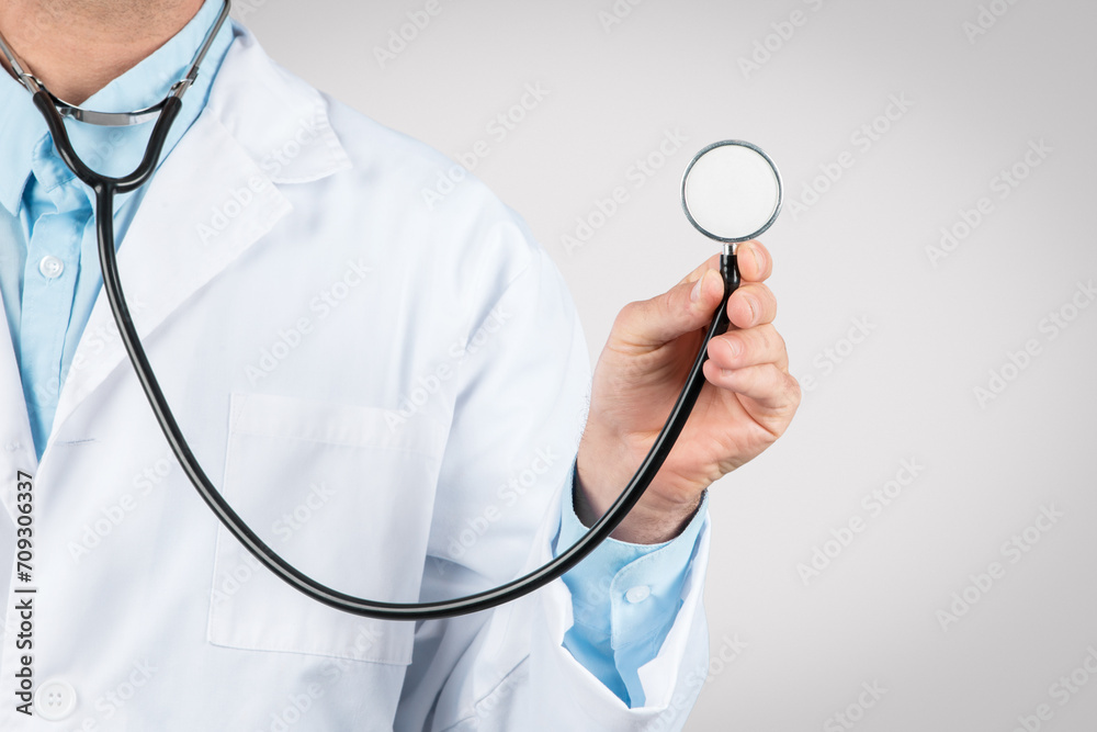 Close-up of doctor's hand holding a stethoscope Close-up of doctor's hand holding a stethoscope