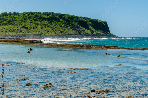 Atalaia beach where there is a natural coral pool and in the background the rock known as the Finger of God in the Fernando de Noronha Archipelago