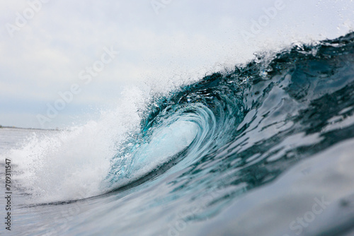 Majestic Ocean Wave Curling in Crystal Clear Water photo