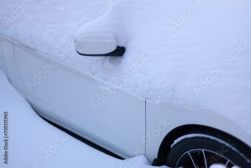 Obraz na płótnie Winter. White car under the snow. Close-up. w salonie