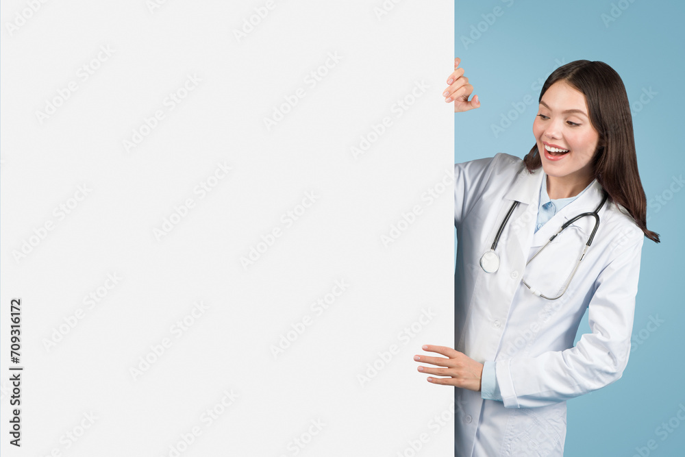 Excited doctor presenting blank board for medical ads Excited doctor presenting blank board for medical ads