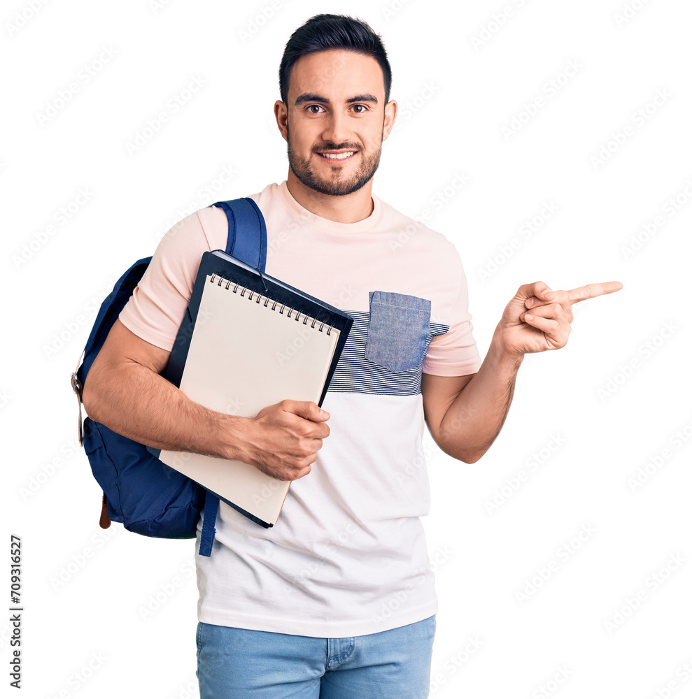 Young handsome man wearing student backpack and notebook smiling happy pointing with hand and finger to the side Young handsome man wearing student backpack and notebook smiling happy pointing with hand and finger to the side