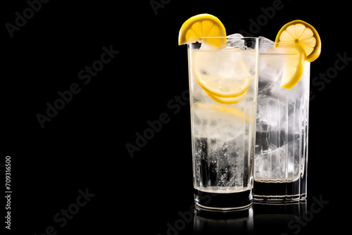 Set of classic Tom Collins or Whiskey sour cocktail with a maraschino cherry and lemon slice on black background