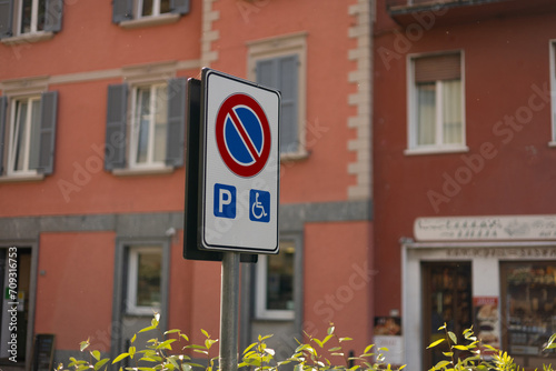 Sign indicating no parking in a space reserved for cars with disabled people. Transportation concept