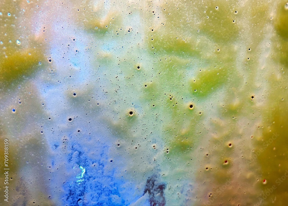 Blue, green, orange, and yellow abstract bubble background 