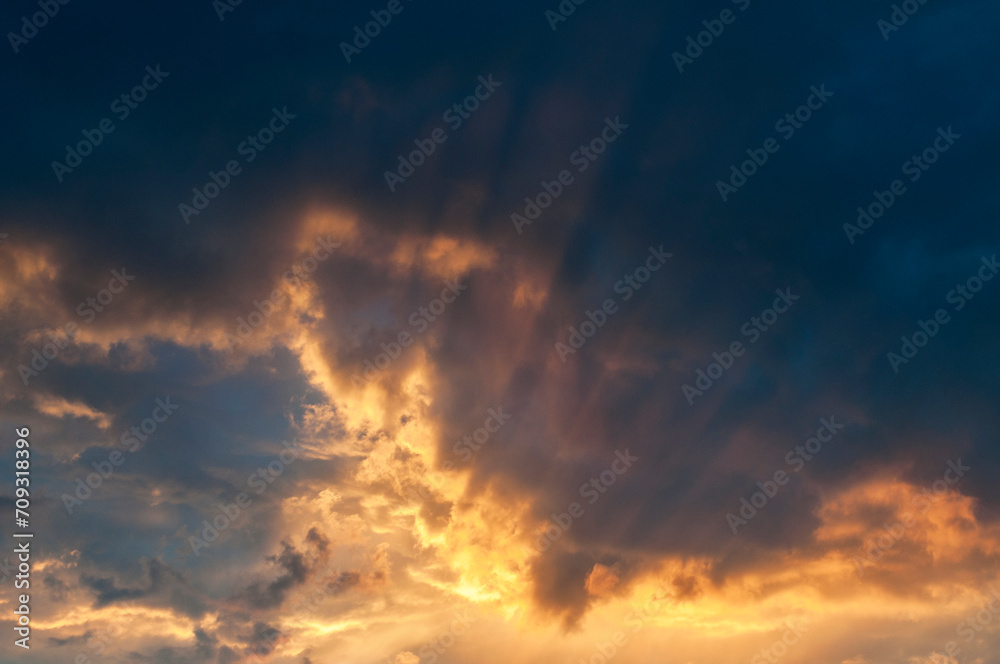 Fototapeta premium Abstract colorful background. Beautiful red sunset over a small town. Dramatic sunset sky with clouds. 
