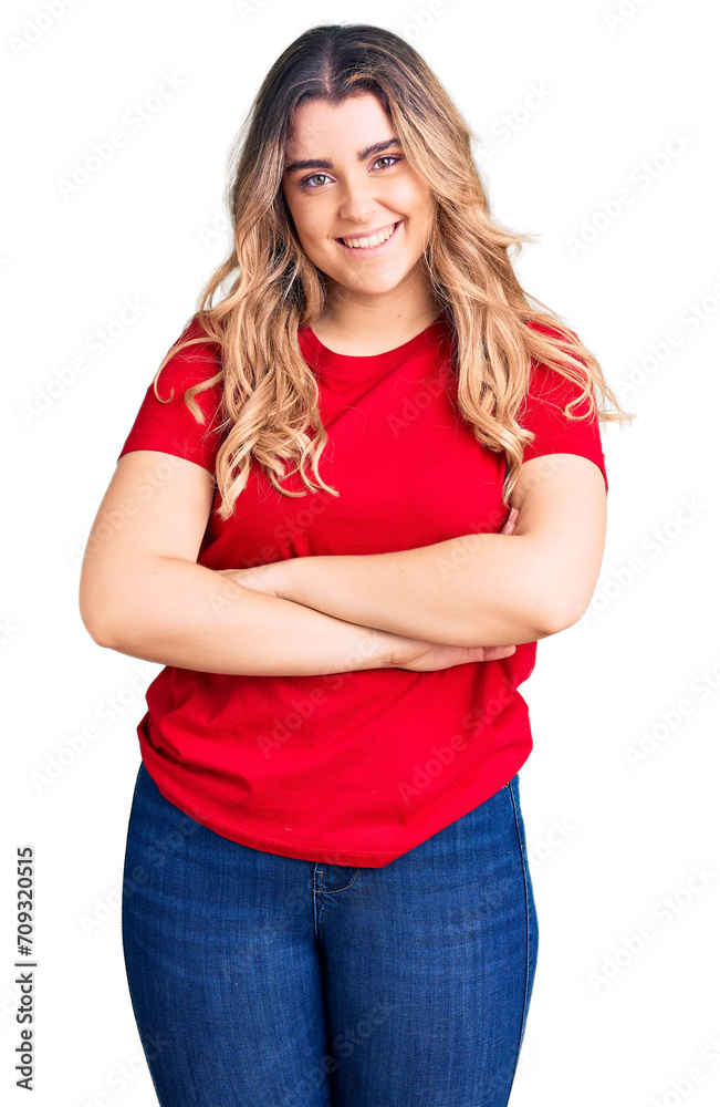 Young caucasian woman wearing casual clothes happy face smiling with crossed arms looking at the camera. positive person. Young caucasian woman wearing casual clothes happy face smiling with crossed arms looking at the camera. positive person.