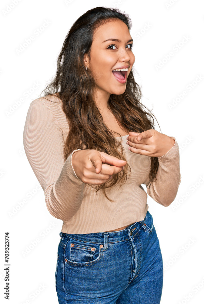 Young hispanic girl wearing casual clothes pointing fingers to camera with happy and funny face. good energy and vibes. Young hispanic girl wearing casual clothes pointing fingers to camera with happy and funny face. good energy and vibes.