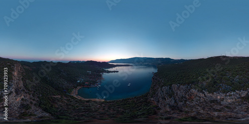 Evening panoramic view of the bay of the ancient Lycian city of Saba near the modern city of Kas in Antalya province, Turkey. Sailing yachts at anchorage. Seamless 360 degree spherical panorama