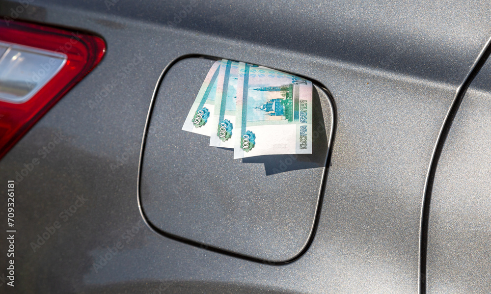 Russian rubles banknotes in the gas tank of a vehicle Russian rubles banknotes in the gas tank of a vehicle