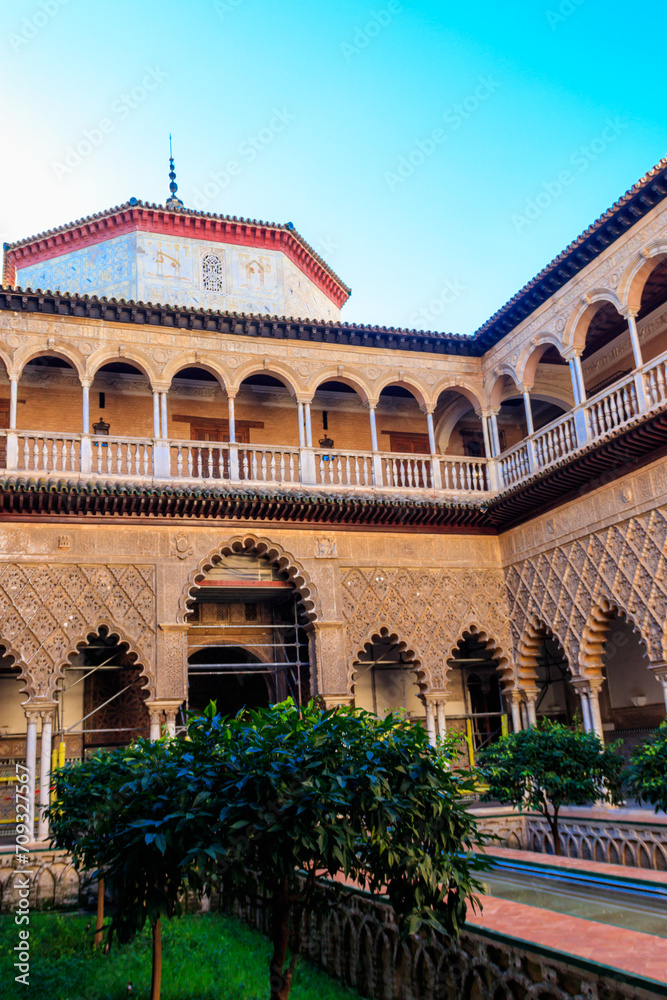 Patio de las Doncellas in Royal palace, Real Alcazar (built in 1360) in Seville, Andalusia, Spain. Real Alcazar is iconic and famous Moorish royal palace