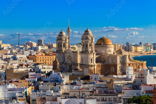 Aerial panoramic view of the old city rooftops and Cathedral de Santa Cruz from tower Tavira in Cadiz, Andalusia, Spain