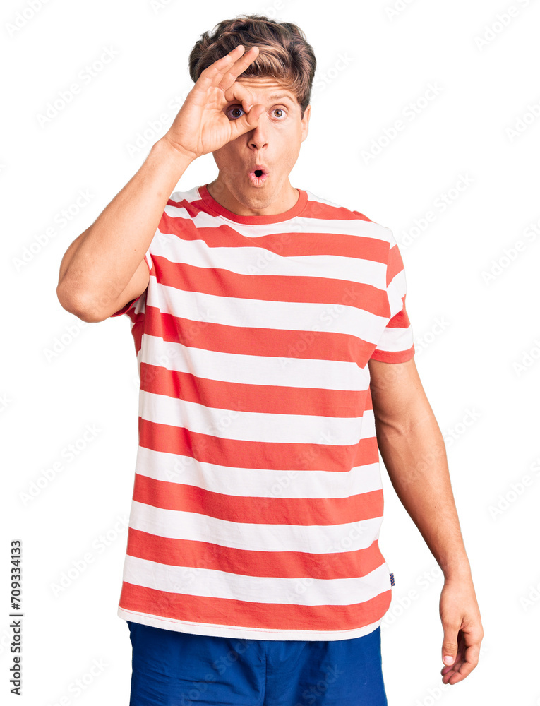 Young handsome man wearing casual clothes doing ok gesture shocked with surprised face, eye looking through fingers. unbelieving expression. Young handsome man wearing casual clothes doing ok gesture shocked with surprised face, eye looking through fingers. unbelieving expression.