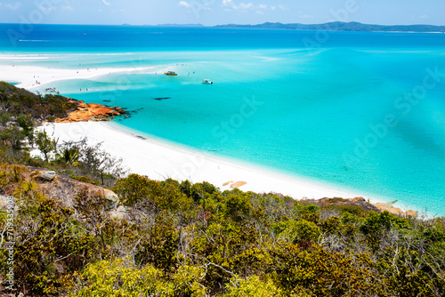 Boats transporting tourists to Whitehaven Beach is on Whitsunday Island. . The beach is known for its crystal white silica sands and turquoise colored waters. Autralia, Dec 2019 © Wagner