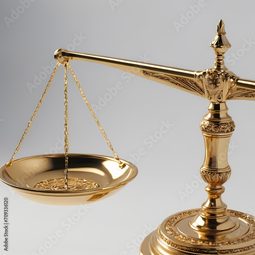 A highly detailed and symbolic image of a balance scale, traditionally associated with justice. The scale is made of polished gold