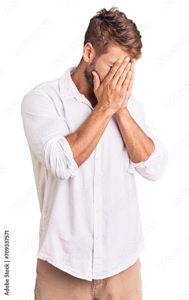 Young caucasian man wearing casual clothes with sad expression covering face with hands while crying. depression concept. Young caucasian man wearing casual clothes with sad expression covering face with hands while crying. depression concept.