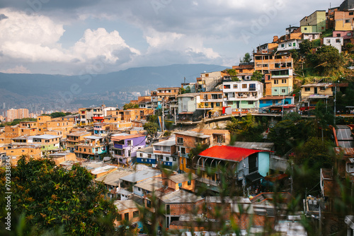 Colorful hillside favela with overcast skies in Medellin photo