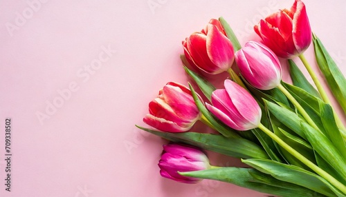 mother s day or valentine romantic concept top view photo giftbox with ribbon bouquet of tulips on pink background with copy spacegenerated