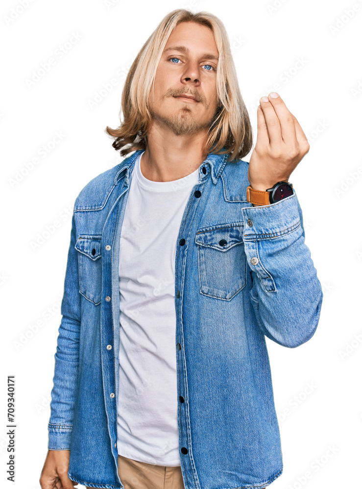 Caucasian man with blond long hair wearing casual denim jacket doing italian gesture with hand and fingers confident expression Caucasian man with blond long hair wearing casual denim jacket doing italian gesture with hand and fingers confident expression
