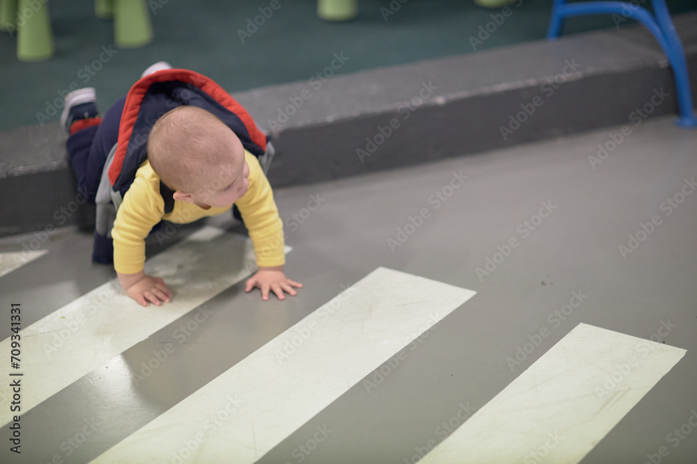 a one-year-old child, a boy, a joyful baby walks a one-year-old child, a boy, a joyful baby walks