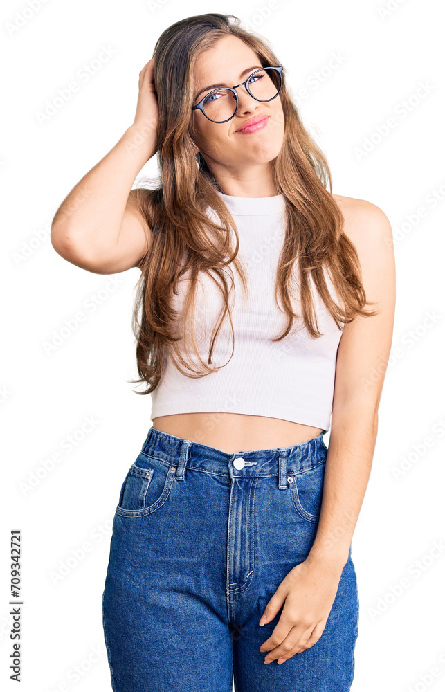 Beautiful caucasian young woman wearing casual clothes and glasses confuse and wonder about question. uncertain with doubt, thinking with hand on head. pensive concept. Beautiful caucasian young woman wearing casual clothes and glasses confuse and wonder about question. uncertain with doubt, thinking with hand on head. pensive concept.