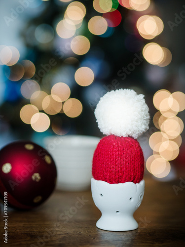 Cozy Santa Hat Serving as an Egg Warmer for Christmas Breakfast
