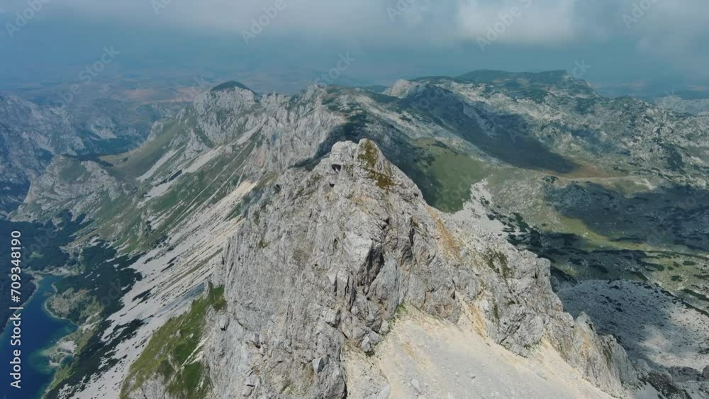Flying in mountains. Bobotov Kuk mount in Durmitor National park in Montenegro. Beautiful aerial mountain landscape, 4k Flying in mountains. Bobotov Kuk mount in Durmitor National park in Montenegro. Beautiful aerial mountain landscape, 4k