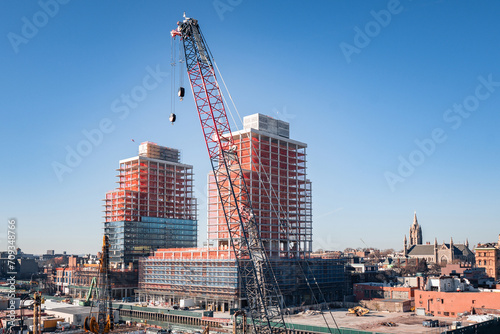 Construction site with new apartment buildings and cranes in Gowanus, Brooklyn, NY