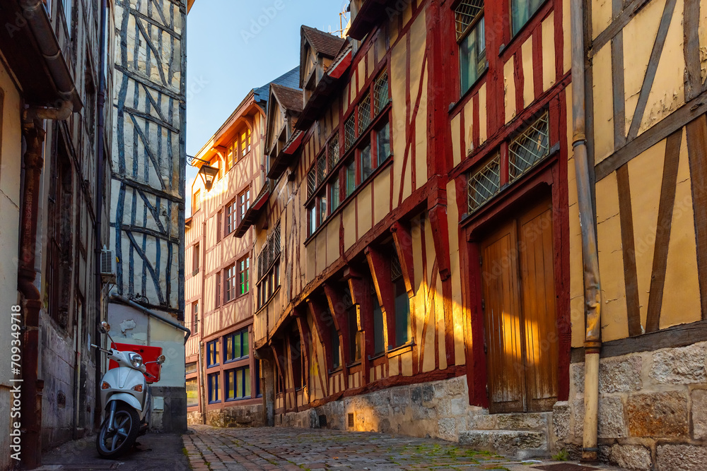 Old cozy street with typical timber frame houses in old town of Rouen, Normandy, France. Architecture and landmarks of Normandie