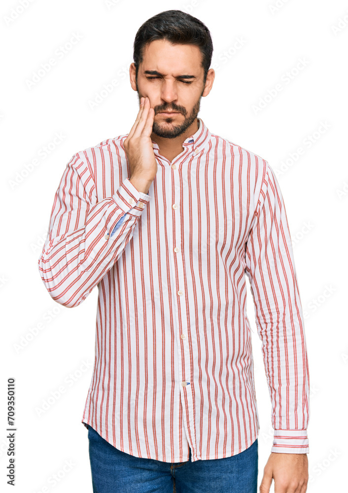 Young hispanic man wearing business shirt touching mouth with hand with painful expression because of toothache or dental illness on teeth. dentist Young hispanic man wearing business shirt touching mouth with hand with painful expression because of toothache or dental illness on teeth. dentist