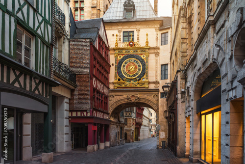Fototapeta Naklejka Na Ścianę i Meble -  Medieval cozy street in Rouen with famos Great clocks or Gros Horloge of Rouen, Normandy, France with nobody. Architecture and landmarks of Normandie